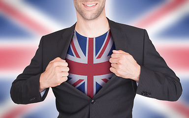 Image showing Businessman opening suit to reveal shirt with flag