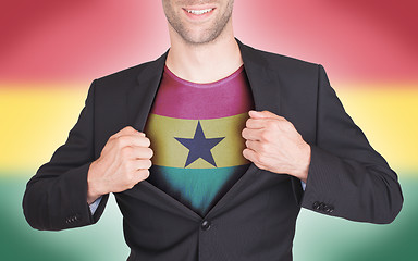 Image showing Businessman opening suit to reveal shirt with flag