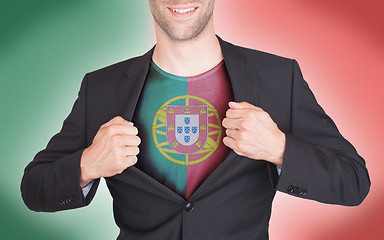 Image showing Businessman opening suit to reveal shirt with flag