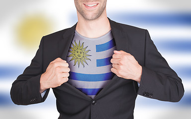 Image showing Businessman opening suit to reveal shirt with flag