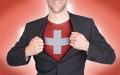 Image showing Businessman opening suit to reveal shirt with flag