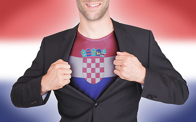 Image showing Businessman opening suit to reveal shirt with flag