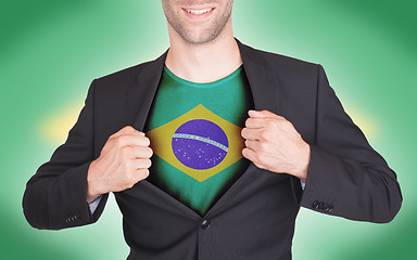 Image showing Businessman opening suit to reveal shirt with flag