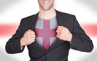 Image showing Businessman opening suit to reveal shirt with flag