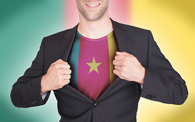 Image showing Businessman opening suit to reveal shirt with flag