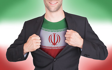 Image showing Businessman opening suit to reveal shirt with flag