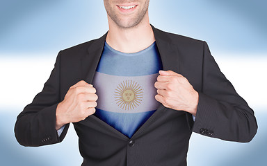 Image showing Businessman opening suit to reveal shirt with flag