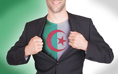 Image showing Businessman opening suit to reveal shirt with flag