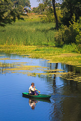 Image showing Man Fishing Out Of A Row Boat