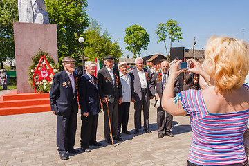 Image showing Unidentified veterans posing at camera during the celebration of