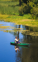 Image showing Man Fishing Out Of A Row Boat