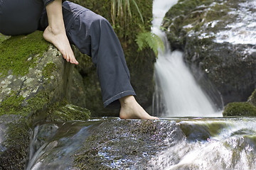 Image showing Sitting by a waterfall