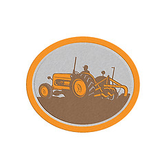 Image showing Metallic Vintage Farm Tractor Farmer Plowing Oval Retro