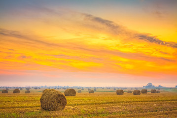 Image showing Sunrise field, hay bale in Belarus.