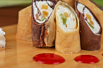 Image showing pancake roll with marmalade