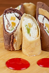 Image showing pancake roll with marmalade