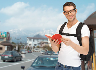 Image showing travelling student with backpack and book