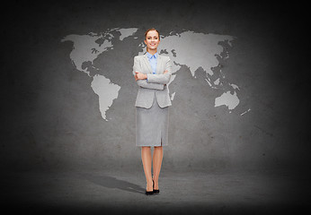 Image showing young smiling businesswoman with crossed arms