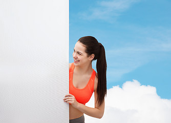 Image showing teenage girl in sportswear with white board