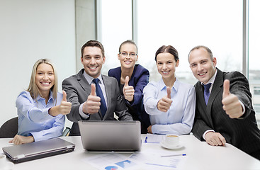 Image showing business team showing thumbs up in office