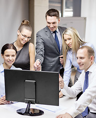 Image showing business team with monitor having discussion