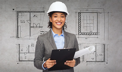 Image showing businesswoman in white helmet with clipboard