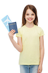 Image showing smiling little girl with ticket and passport