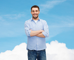 Image showing smiling man with crossed arms