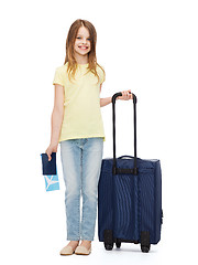 Image showing smiling girl with suitcase, ticket and passport