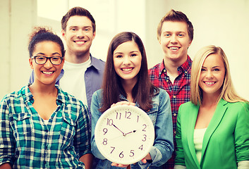 Image showing group of students at school with clock