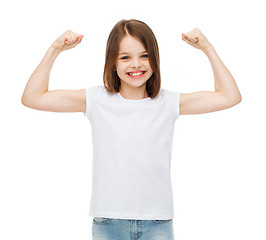 Image showing little girl in blank white t-shirt showing muscles