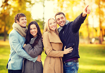 Image showing group of friends having fun in autumn park