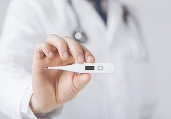 Image showing male doctor with thermometer