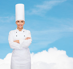 Image showing smiling female chef with crossed arms