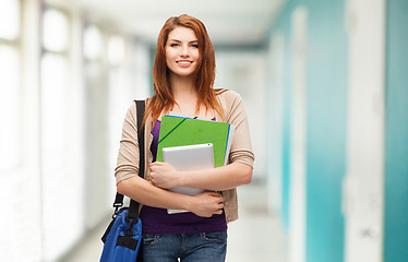 Image showing smiling student with bag, folders and tablet pc