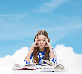 Image showing stressed student girl with books