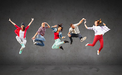 Image showing group of teenagers jumping