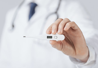 Image showing male doctor with thermometer