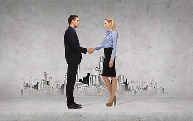 Image showing businessman and businesswoman shaking hands