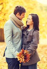 Image showing romantic couple kissing in the autumn park