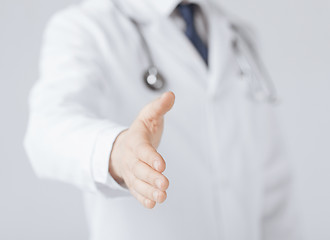 Image showing male doctor with open hand ready for hugging