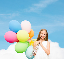 Image showing happy girl with colorful balloons