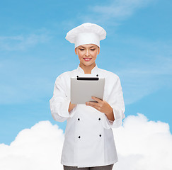 Image showing smiling female chef with tablet pc computer