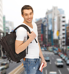 Image showing travelling student with backpack and book