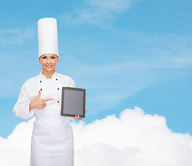 Image showing smiling female chef with tablet pc blank screen