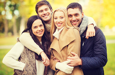 Image showing group of friends having fun in autumn park