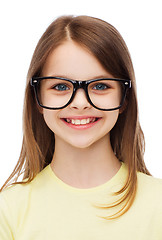 Image showing smiling cute little girl in black eyeglasses