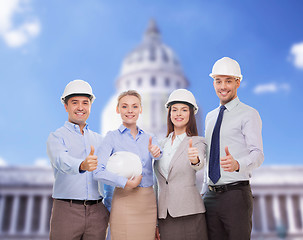 Image showing happy business team in office showing thumbs up