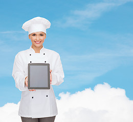 Image showing smiling female chef with tablet pc blank screen