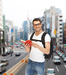 Image showing travelling student with backpack and book